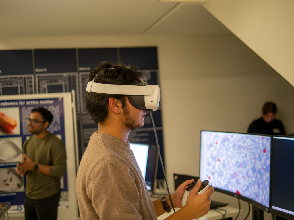 A researcher is watching molecular dynamics simulations with a VR headset.